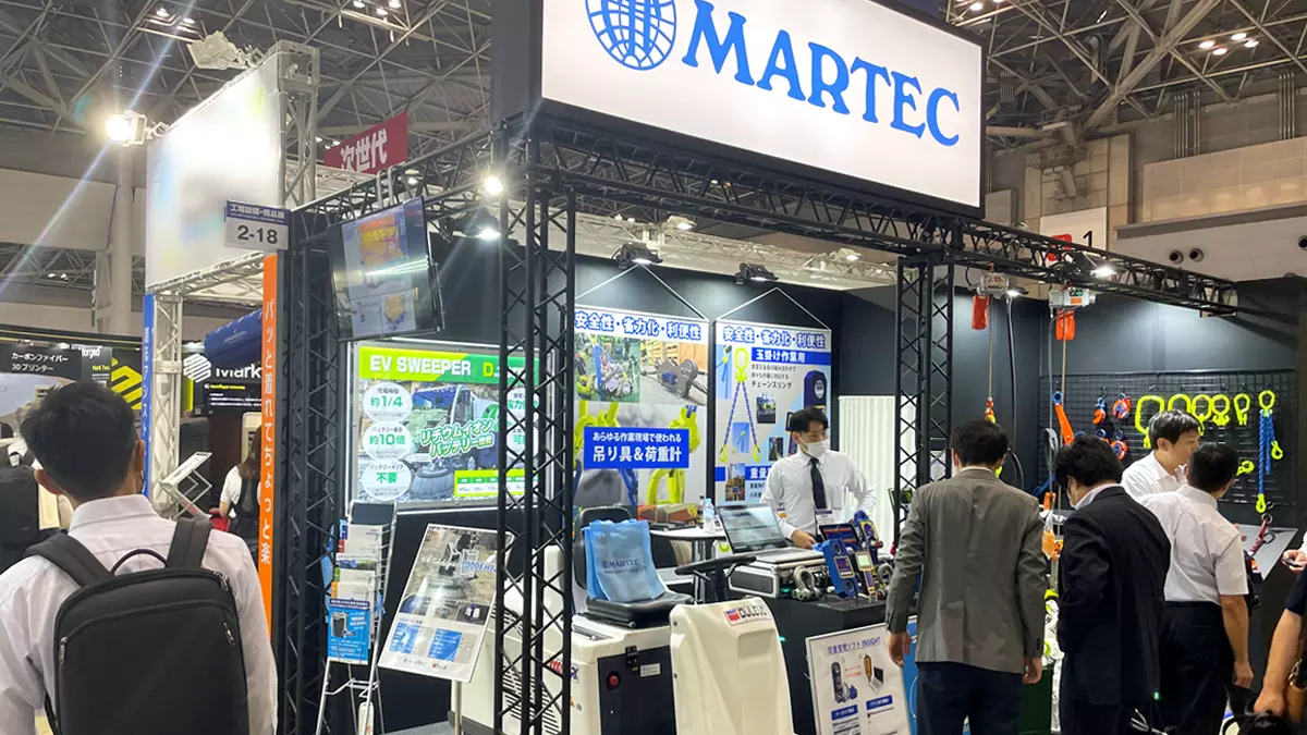 Interested visitors inquiring about MARTEC products at the Manufacturing World Japan 2023 show in Tokyo