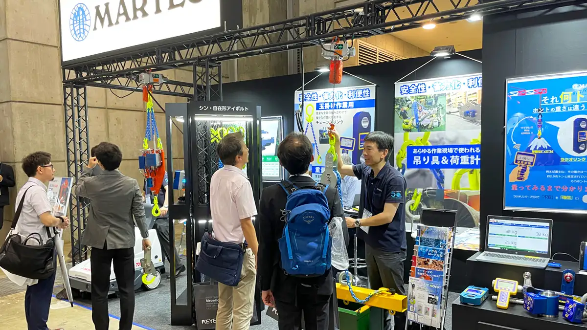 Interested visitors inquiring about MARTEC products at the Manufacturing World Tokyo 2024.